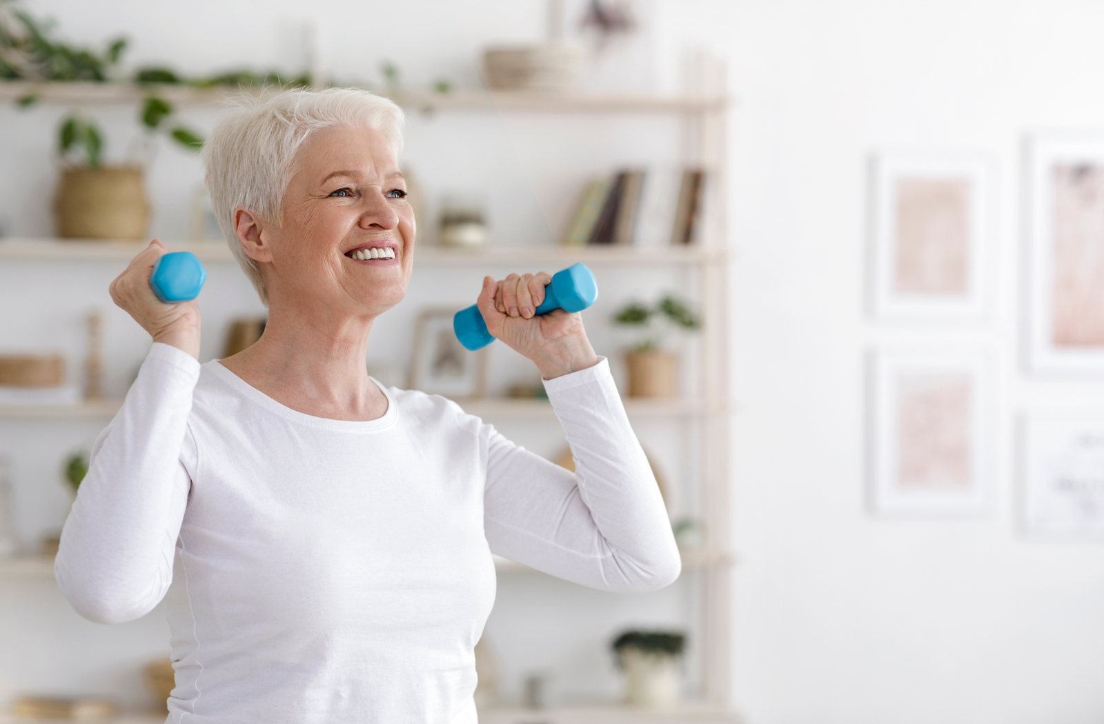 Senior women Exercising With Dumbbells part of exercise program for her